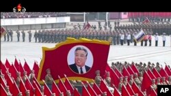 In this image made from video broadcast by North Korean broadcaster KRT, a portrait of the country's founder, Kim Il Sung, is carried during a parade at Kim Il Sung Square in Pyongyang, April 15, 2017.