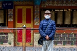 Kalsang Chokteng, an in exile Tibetan, poses for a photograph in Dharmsala, India, Tuesday, July 21, 2020. Kalsang says that people who do not want to wear masks are selfish and should think of the impact of their careless action on others.