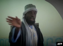 FILE - Photo made from Boko Haram video released by the Nigerian Islamist extremist group Boko Haram and obtained by AFP shows the leader of the Nigerian Islamist extremist group Boko Haram, Abubakar Shekau preaching to locals in an unidentified town.