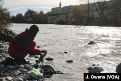 Many refugees and migrants in Ventimiglia, Italy, live near the river Roya, where they wash clothes and bathe.