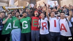 Algerians march during a protest in Algiers, Algeria, March 15, 2019.
