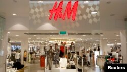 The company logo is placed at the flagship store of H&M, Hennes & Mauritz, the world's second-biggest fashion retailer in Sweden's capital Stockholm, file photo. 