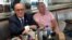 FILE - Rudy Giuliani is seen with Ukrainian-American businessman Lev Parnas at the Trump International Hotel in Washington, Sept. 20, 2019. Parnas has been arrested with another associate of Giuliani's, Igor Fruman, a Belarus-born U.S. citizen.