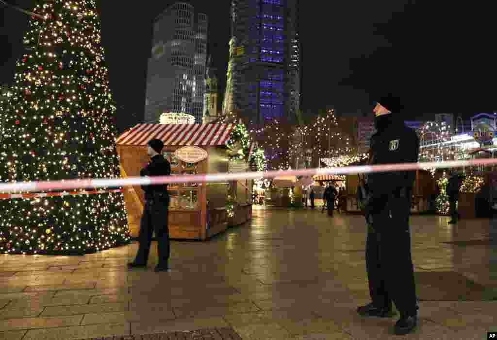 Police guard a Christmas market after a truck ran into the crowded market in Berlin, Germany.