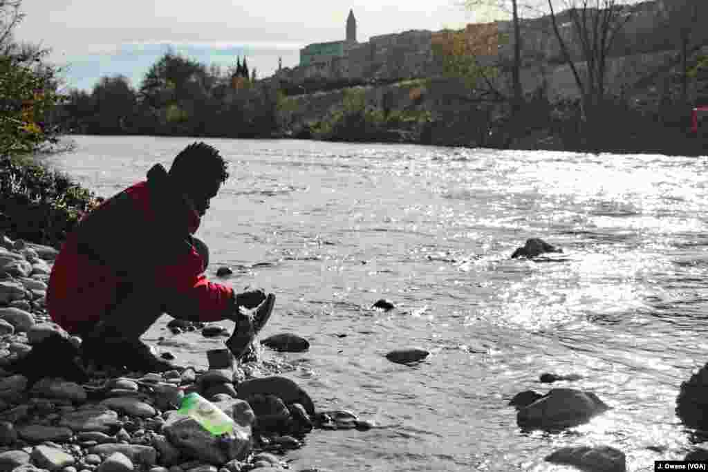 Many refugees and migrants in Ventimiglia, Italy, live near the river Roya, where they wash clothes and bathe.