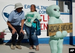 Little A'Le'Inn owner Connie West, right, laughs with Kirk Schultz outside of the bar and restaurant, Wednesday, Sept. 18, 2019, in Rachel, Nev. The the two were helping to prepare for upcoming events spawned from the "Storm Area 51" internet hoax. (AP Photo/John Locher)