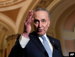 FILE - Senate Minority Leader Chuck Schumer, D-N.Y., speaks to reporters ahead of President Donald Trump's first State of the Union address, at the Capitol in Washington, Jan. 30, 2018.