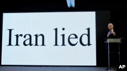 FILE - Israeli Prime Minister Benjamin Netanyahu presents material on Iranian nuclear weapons development during a press conference in Tel Aviv, April 30 2018.