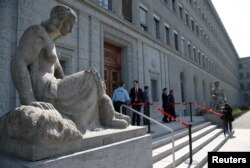 FILE - People are pictured in the headquarters of the World Trade Organization (WTO) in Geneva, Switzerland, April 12, 2017.