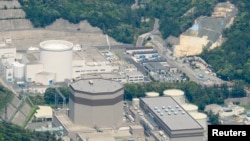 Une vue aérienne montre la centrale nucléaire Japan Atomic Power Co.'s Tsuruga à Tsuruga, prefecture de Fukui, Japon.
