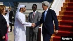 U.S. Secretary of State John Kerry is greeted by Shehab Al-Fahim from the Ministry of Foreign Affairs upon his arrival in Abu Dhabi, United Arab Emirates, Nov. 15, 2016.