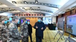 Chinese President Xi Jinping learns about the hospital's operations, treatment of patients, protection for medical workers and scientific research in Wuhan, the epicentre of the novel coronavirus outbreak, Hubei province, China, March 10, 2020.