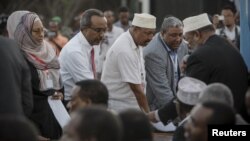 New parliamentarians are sworn-in during an inauguration ceremony for members of Somalia's first parliament in 20 years in Mogadishu, August 20, 2012.