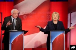 Democratic presidential candidate Senator Bernie Sanders listens to a point made by rival candidate Hillary Clinton during a presidential primary debate hosted by MSNBC in Durham, N.H., Feb. 4, 2016.