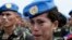 FILE - Philippine Navy Petty Officer 2 Ellen Paculba, one of 157 Philippine troops who were deployed in Haiti as U.N. Peacekeepers, cries during sendoff ceremony, Sept. 22, 2014.