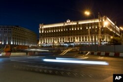 In this photo taken July 24, 2017, a car passes the building of the Federal Security Service (FSB, Soviet KGB successor) in Lubyanskaya Square in Moscow.