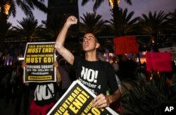 Nicholas Maldonado, 23, of San Pedro, protests outside of California Republican Convention in Anaheim, Calf., Oct. 20, 2017. Protesters have gathered outside a Southern California hotel where former White House adviser Steve Bannon gave the keynote speech at a state Republican convention.