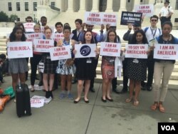 Immigrant advocates gather outside the U.S. Supreme Court in Washington after the justices’ tie vote left in place a ruling that blocked President Barack Obama's plan to extend deportation protection to millions of undocumented immigrants, June 23, 2016. (A. Barros/VOA)