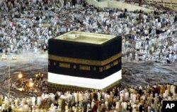 FILE - Pilgrims circle the Kabaa at the Great Mosque, Islam's holiest shrine, in Mecca, Saudi Arabia, Jan. 17, 2005.