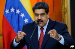 Venezuelan President Nicolas Maduro gives a press conference at Miraflores presidential palace in Caracas, Venezuela, Jan. 25, 2019.