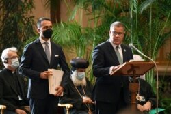 President of the 2021 United Nations Climate Change Conference, COP26, Alok Sharma, right, and Italian Foreign Minister Luigi Di Maio attend a conference at the Vatican, Oct. 4, 2021.