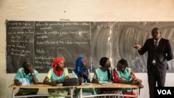These students will help lead money savings and loaning groups in their classrooms. (Photo: Chika Oduah for VOA)
