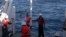 Scientists and sailors on the Indonesian research vessel, the RV Baruna Jaya VIII collect sediment cores off the coast of Indonesia. (Yair Rosenthal/Rutgers University)