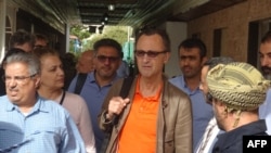 Retired Dutch Gen. Patrick Cammaert, center, who is leading a joint committee tasked with overseeing a truce in the port city and the withdrawal of both parties, arrives at the Yemeni port of Hodeidah, Jan. 13, 2019. 