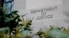 FILE - Signage marks an exterior wall of the U.S. Department of Justice Building in Washington, Jan. 23, 2023. 