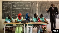These students will help lead money savings and loaning groups in their classrooms. (Photo: Chika Oduah for VOA) 