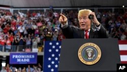 President Donald Trump speaks at a rally at AMSOIL Arena in Duluth, Minnesota, June 20, 2018. 