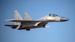 In this undated file photo released by the Taiwan Ministry of Defense, a Chinese PLA J-16 fighter jet flies in an undisclosed location. (Taiwan Ministry of Defense via AP, File)