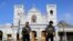 FILE - Sri Lankan soldiers stand guard in front of the St. Anthony's Shrine in Colombo, Sri Lanka, April 22, 2019. A day earlier, on Easter Sunday, bombs shattered the celebratory services at two Catholic churches and a Protestant church in Sri Lanka.
