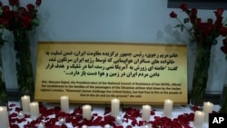 Candles and flowers are displayed at at the Los Angeles Convention Center Jan. 11, 2020, in a memorial to the passengers of the Ukrainian jetliner shot down by Iran by accident.