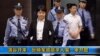 Video image from CCTV shows Gu Kailai, second from left, being taken into the Intermediate People's Court, Hefei, China, Aug. 9, 2012.