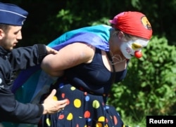 Police detain a demonstrator during a protest against a NATO summit in Brussels, Belgium, May 25, 2017.