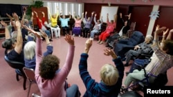 Laughter therapy class for seniors at the Clairmont Friendship Center in San Diego, California November 17, 2010.