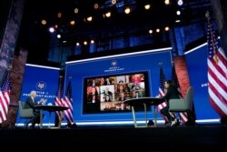 President-elect Joe Biden and Vice President-elect Kamala Harris participate in a meeting with the National Governors Association's executive committee at The Queen theater, Nov. 19, 2020, in Wilmington, Del.