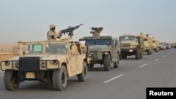 Egyptian Army's armored vehicles are seen on a highway to North Sinai during a launch of a major assault against militants, in Ismailia, Egypt, in this undated handout picture from the Ministry of Defense, Feb. 9, 2018.
