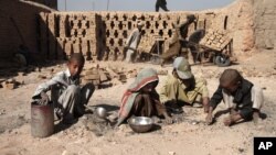 Afghan children work at a local brick factory in Jalalabad, Nangarhar province, Afghanistan, October 8, 2012.