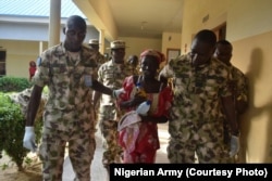 FILE - The rescued Chibok school girl, Amina Ali, was airlifted by Nigeria Air Force from Damboa to Maiduguri alongside her baby and supposed husband.