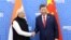 ប្រធានាធិបតី​ចិន លោក Xi Jinping (ស្តាំ) និង​នាយករដ្ឋមន្ត្រី​ឥណ្ឌា លោក Narendra Modi បាន​ជួប​គ្នា​ក្រៅ​កិច្ចប្រជុំ​កំពូល BRICS នៅទីក្រុង Kazan ប្រទេស​រុស្ស៊ី កាលពី​ថ្ងៃទី២៣ ខែតុលា ឆ្នាំ២០២៤។