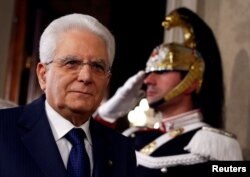 FILE - Italian President Sergio Mattarella speaks to reporters at the Quirinal Palace in Rome, April 5, 2018.