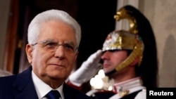 FILE - Italian President Sergio Mattarella speaks to reporters at the Quirinal Palace in Rome, April 5, 2018. 
