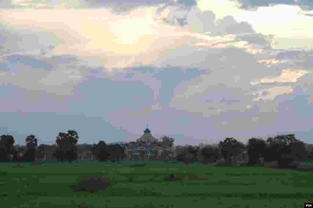 Baha&rsquo;i temple shot from a Bamboo train, also known as &lsquo;Norry&rsquo;. The temple compound occupies approximately less than 2 hectares of land with another 7 hectares providing a scenic view of the surrounding meadow and vast rice field. (Rithy Odom/VOA)