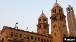 Laborers work on the restoration of the Coptic Christian Cathedral complex in the aftermath of a bomb attack, in Cairo, Egypt, Dec. 17, 2016.