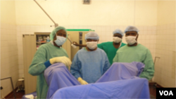 Doctors confer before they begin surgery, Yaounde, Cameroon, June, 2014. (Moki Edwin Kindzeka/VOA)