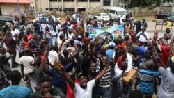 Supporters of the separatist leader Nnamdi Kanu protest during Kanu's trial at the Federal High Court in Abuja, Nigeria, on Oct. 21, 2021.