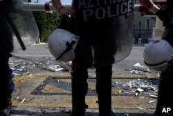 Boxes of fish are seen after protesters from a communist-backed labor union threw them at police outside parliament, during a protest against a recent vote on new austerity measures in Athens, June 9, 2017.