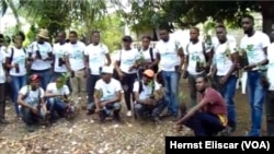 Members of Rotaract Club hold prepare to plant trees in Beret, Haiti for World Environment Day.